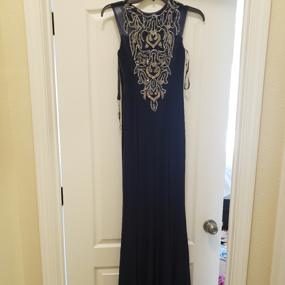 A long dark blue ball gown dress